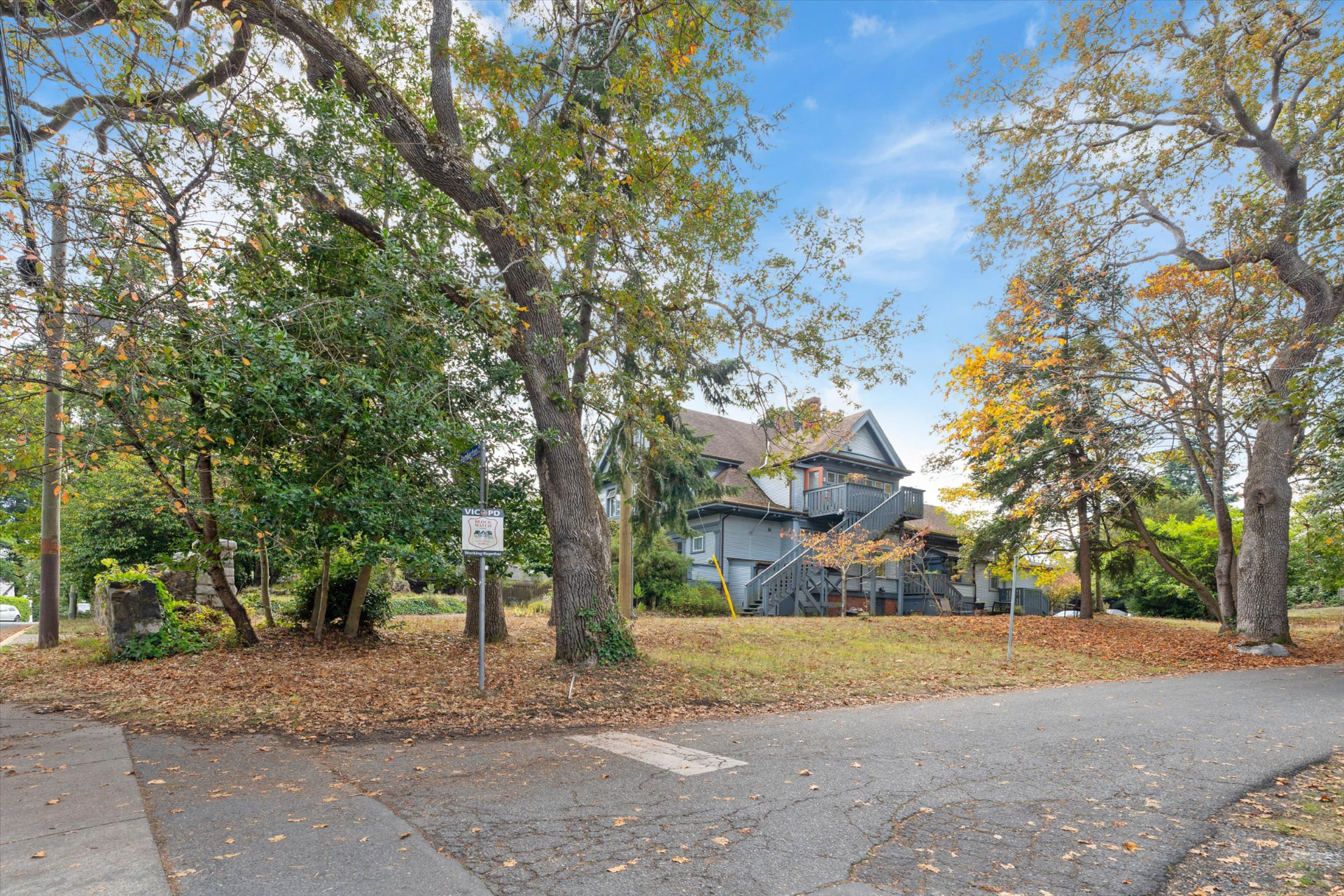Corner of Pemberton Road and Carberry Gardens with mature oaks and open lawn